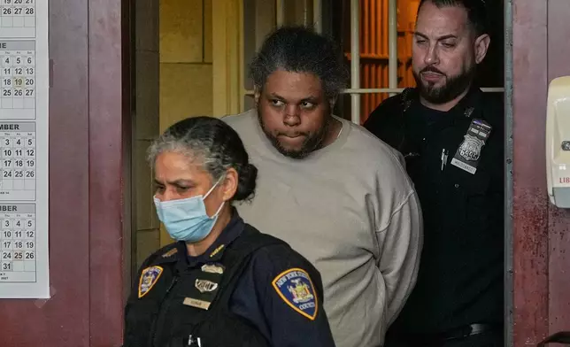Randy Santos enters court for sentencing for fatally beating four sleeping men on the streets in 2019, in New York, Thursday, May 28, 2026. (AP Photo/Richard Drew)