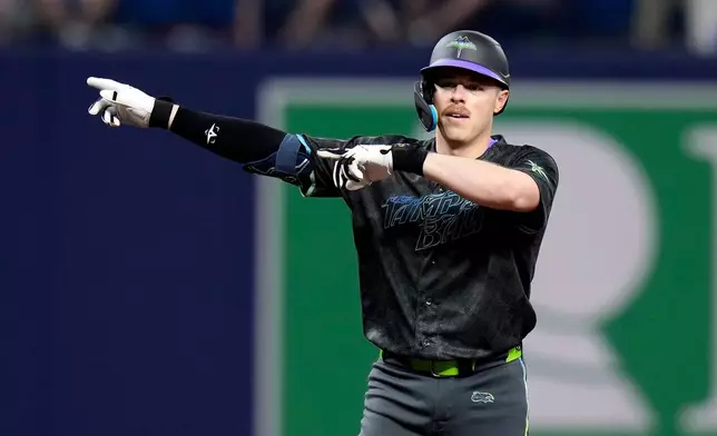 Tampa Bay Rays' Hunter Feduccia celebrates after his double off San Francisco Giants pitcher Landen Roupp during the fifth inning of a baseball game Saturday, May 2, 2026, in St. Petersburg, Fla. (AP Photo/Chris O'Meara)