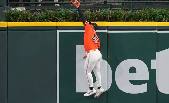 Detroit Tigers right fielder Wenceel Pérez catches a Texas Rangers' Evan Carter fly ball during the first inning of a baseball game Friday, May 1, 2026, in Detroit. (AP Photo/Paul Sancya)