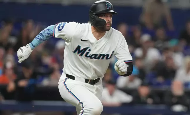Miami Marlins' Joe Mack runs after hitting a double in the ninth inning of a baseball game against the Baltimore Orioles Thursday, May 7, 2026, in Miami. (AP Photo/Marta Lavandier)