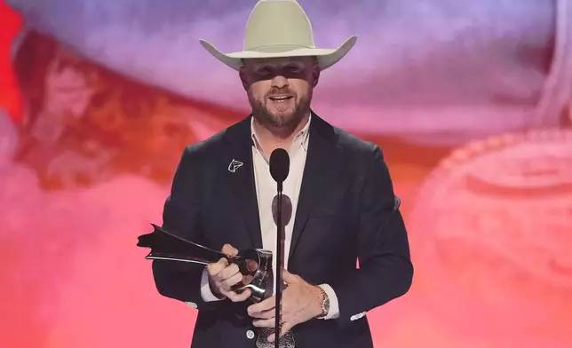 Cody Johnson accepts the award for male artist of the year during the 61st annual Academy of Country Music Awards on Sunday, May 17, 2026, at the MGM Grand Garden Arena in Las Vegas. (AP Photo/Chris Pizzello)