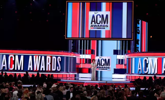 FILE - Reba McEntire appears on stage at the 54th annual Academy of Country Music Awards in Las Vegas on April 7, 2019. (Photo by Chris Pizzello/Invision/AP, File)