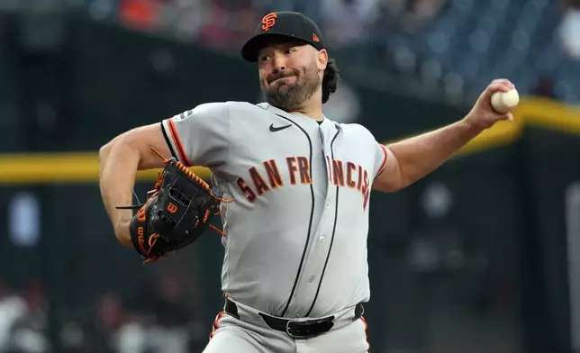 San Francisco Giants pitcher Robbie Ray throws against the Arizona Diamondbacks in the first inning of a baseball game, Monday, May 18, 2026, in Phoenix. (AP Photo/Rick Scuteri)