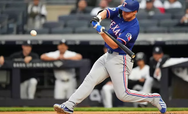 Texas Rangers' Corey Seager hits a home run during the first inning of a baseball game against the New York Yankees, Wednesday, May 6, 2026, in New York. (AP Photo/Frank Franklin II)
