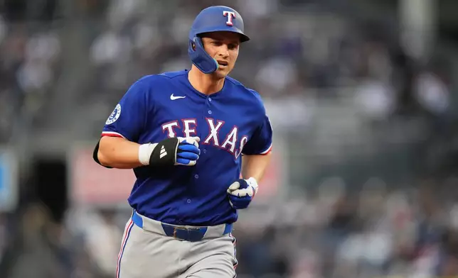 Texas Rangers' Corey Seager runs the bases after hitting a home run during the first inning of a baseball game against the New York Yankees Wednesday, May 6, 2026, in New York. (AP Photo/Frank Franklin II)