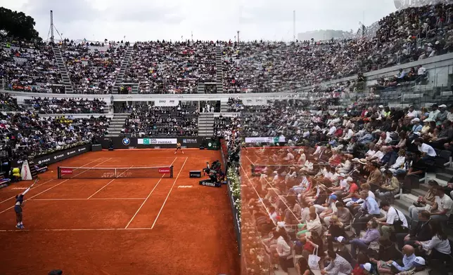 Croatia's Dino Prizmic, left, serves the ball to Serbia's Novak Djokovic during their match at the Italian Open tennis tournament, in Rome, Friday, May 8, 2026. (AP Photo/Andrew Medichini)