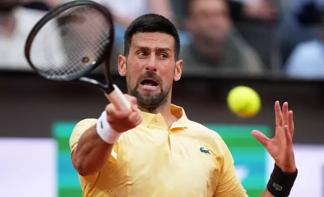 Serbia's Novak Djokovic returns the ball to Croatia's Dino Prizmic during their match at the Italian Open tennis tournament, in Rome, Friday, May 8, 2026. (AP Photo/Andrew Medichini)
