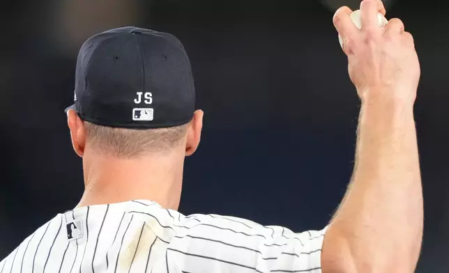 New York Yankees' cap is stitched with "JS" in tribute to retired New York Yankees broadcaster John Sterling during the ninth inning of a baseball game between the New York Yankees and the Baltimore Orioles, Monday, May 4, 2026, in New York. (AP Photo/Yuki Iwamura)