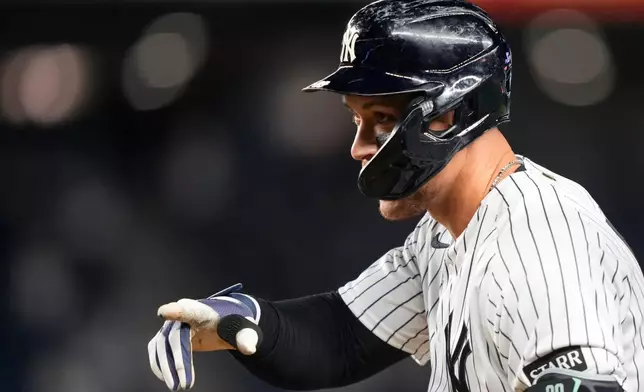 New York Yankees' Aaron Judge (99) reacts after hitting an RBI single during the eighth inning of a baseball game against the Baltimore Orioles, Monday, May 4, 2026, in New York. (AP Photo/Yuki Iwamura)