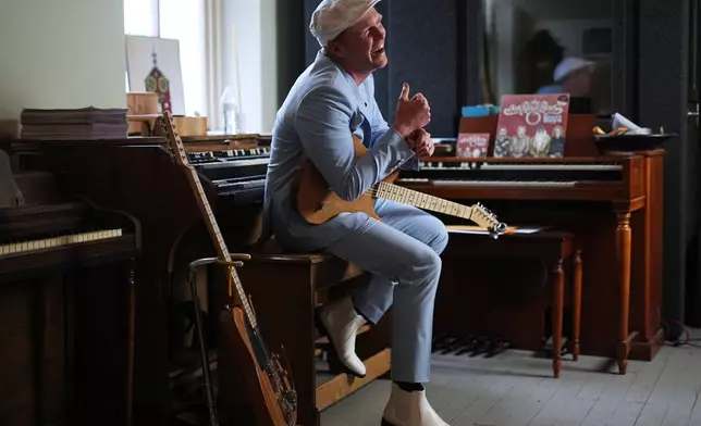 Conrad Fisher laughs during an interview with the Associated Press ahead of his performance at Ragamuffin Hall in McCoysville, Pa., Saturday, April 25, 2026. (AP Photo/Matt Rourke)