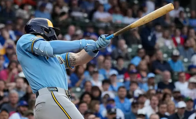 Milwaukee Brewers' Garrett Mitchell hits a one-run single during the first inning of a baseball game against the Chicago Cubs in Chicago, Tuesday, May 19, 2026. (AP Photo/Nam Y. Huh)