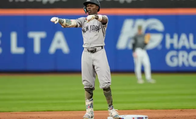 New York Yankees' Jazz Chisholm Jr. reacts after hitting a double during the second inning of a baseball game against the New York Mets, Saturday, May 16, 2026, in New York. (AP Photo/Yuki Iwamura)