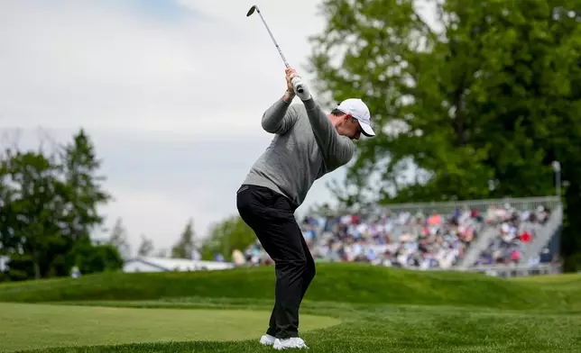 Rory McIlroy, of Northern Ireland, hits from the 13th fairway during a PGA Championship golf tournament practice round at Aronimink Golf Club, Wednesday, May 13, 2026, in Newtown Square, PA. (AP Photo/Carolyn Kaster)