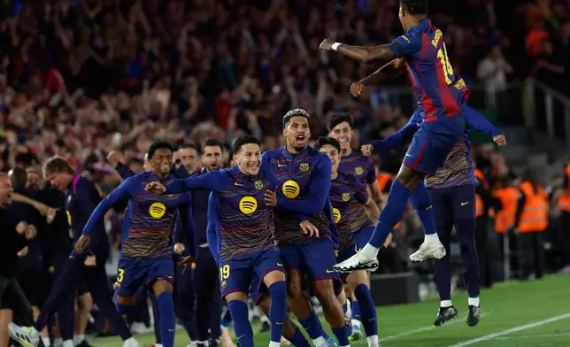Barcelona's Marcus Rashford celebrates the opening goal during the Spanish La Liga soccer match between FC Barcelona and Real Madrid in Barcelona, Spain, Sunday, May 10, 2026. (AP Photo/Joan Monfort)