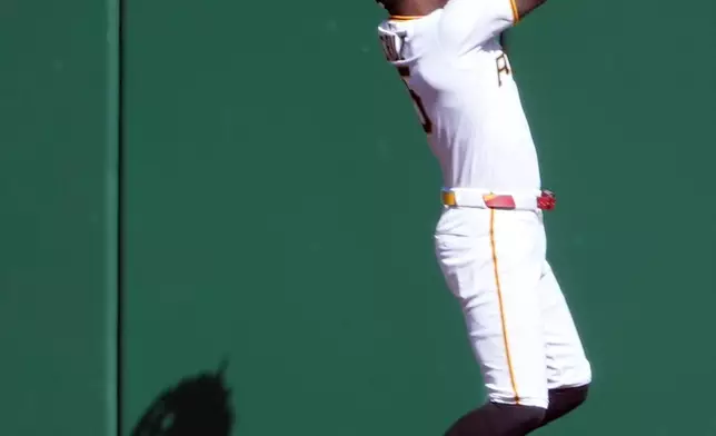 Pittsburgh Pirates center fielder Oneil Cruz is unable to make a leaping catch of a triple hit by Minnesota Twins' Kody Clemens in the third inning of a baseball game in Pittsburgh, Saturday, May 30, 2026. (AP Photo/Tom E. Puskar)