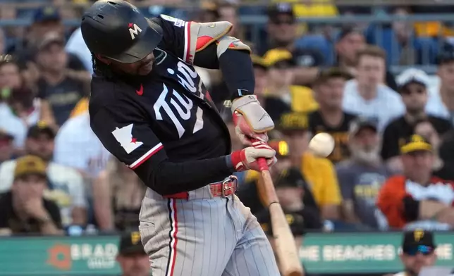 Minnesota Twins' Byron Buxton singles off Pittsburgh Pirates pitcher Mason Montgomery int the eighth inning of a baseball game in Pittsburgh, Saturday, May 30, 2026. (AP Photo/Tom E. Puskar)