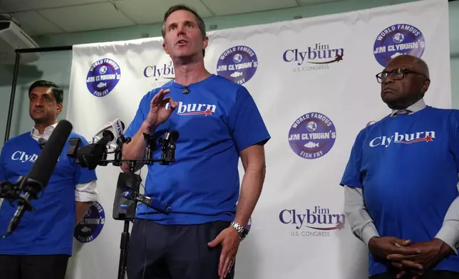 Democratic Gov. Andy Beshear of Kentucky, center, speaks to reporters as U.S. Rep. Ro Khanna, D-Calif., and U.S. Rep. Jim Clyburn, D-S.C., look on, ahead of remarks at Clyburn's "World Famous Fish Fry" event on Friday, May 29, 2026, in Columbia S.C. (AP Photo/Meg Kinnard)