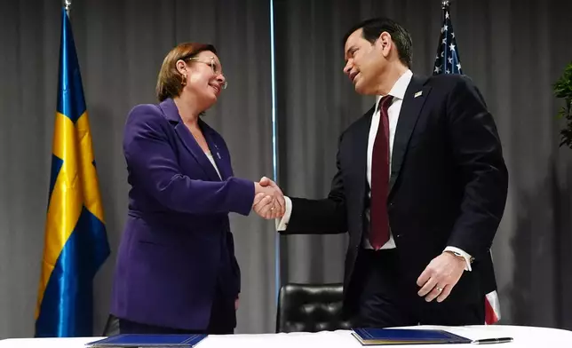United States Secretary of State Marco Rubio, right, and Sweden's Foreign Minister Maria Malmer Stenergard shake hands during a signing ceremony on the sidelines of a meeting of NATO foreign ministers in Helsingborg, Sweden, Friday, May 22, 2026. (AP Photo/Julia Demaree Nikhinson, Pool)