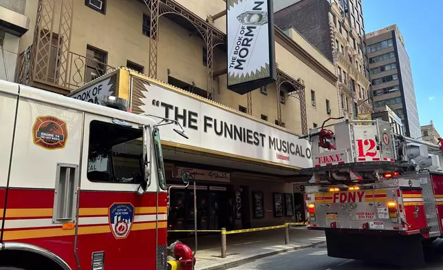 Firetrucks are parked outside of the Eugene O'Neill Theatre in New York on Monday, May 4, 2026. (AP Photo/David Martin)