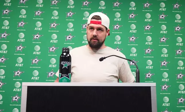 Dallas Stars left wing Jamie Benn stands at the podium for questions during a media availability Monday, May 4, 2026, in Frisco, Texas. (AP Photo/LM Otero)