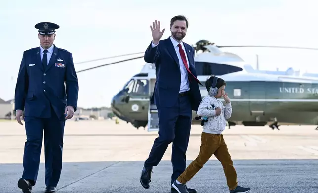 Vice President JD Vance and his son Vivek, walk to board Air Force Two at Joint Base Andrews, Md., Tuesday, May 5, 2026. Vance is traveling to Ohio, Oklahoma, and Iowa. (Roberto Schmidt /Pool Photo via AP)