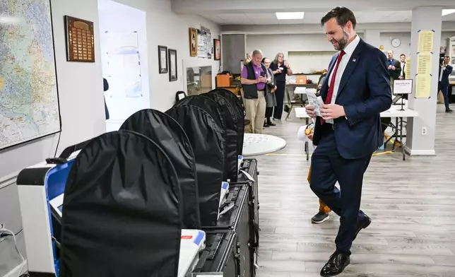 Vice President JD Vance casts his ballot to vote at a polling location at St. Anthony of Padua Maronite Catholic Church in the state's primary election, Tuesday, May 5, 2026, in Cincinnati, Ohio. Vance is stopping in Ohio to vote in the state's primary election before continuing on to Oklahoma and Iowa. (Roberto Schmidt /Pool Photo via AP)