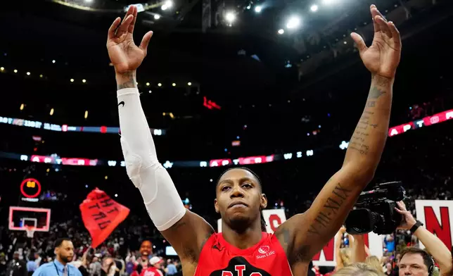 Toronto Raptors' RJ Barrett (9) celebrates after defeating the Cleveland Cavaliers in overtime of Game 6 in the first round of an NBA basketball playoffs series in Toronto on Friday, May 1, 2026. (Frank Gunn/The Canadian Press via AP)