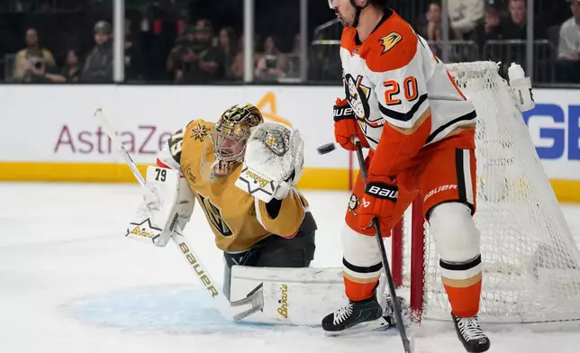 Vegas Golden Knights goaltender Carter Hart (79) attempts to stop a shot by the Anaheim Ducks during the first period of Game 2 of a second-round NHL hockey Stanley Cup playoff series Wednesday, May 6, 2026, in Las Vegas. (AP Photo/John Locher)