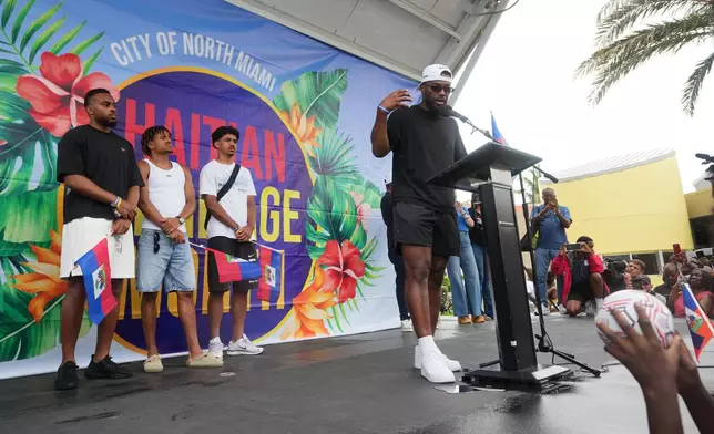 Haiti national soccer team striker Duckens Nazon, right, speaks as his teammates look on at a Haitian Heritage Month event, Saturday, May 30, 2026, in North Miami, Fla., ahead of the FIFA World Cup soccer tournament. (AP Photo/Lynne Sladky)