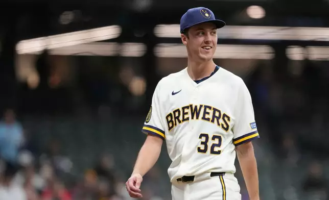 Milwaukee Brewers' Jacob Misiorowski smiles as he walks to the dugout during the fourth inning of a baseball game against the San Diego Padres, Wednesday, May 13, 2026, in Milwaukee. (AP Photo/Aaron Gash)