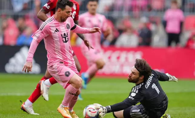Toronto FC goalkeeper Luka Gavran (1) stops Inter Miami CF midfielder Lionel Messi (10) during second half MLS soccer in Toronto on Saturday, May 9, 2026. (Frank Gunn /The Canadian Press via AP)