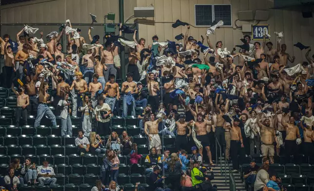 Milwaukee Brewer fans cheer during the fifth inning of a baseball game against the Los Angeles Dodgers, Friday, May 22, 2026, in Milwaukee. (AP Photo/Jeffrey Phelps)