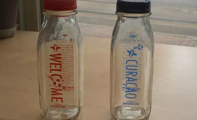 This image made from videos shows special bottles of The Shatto Milk Company milk with flavors themed for participating countries to celebrate the 2026 FIFA World Cup on display Tuesday, April 28, 2026, in Kansas City, Mo. (AP Photo/Nick Ingram)
