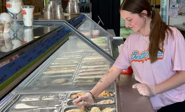 Riley Mustard, a scooper at Betty Rae's Ice Cream, puts an order together on Tuesday, April 28, 2026, in Kansas City, Mo., as the store prepares for the 2026 FIFA World Cup. (AP Photo/Nick Ingram)