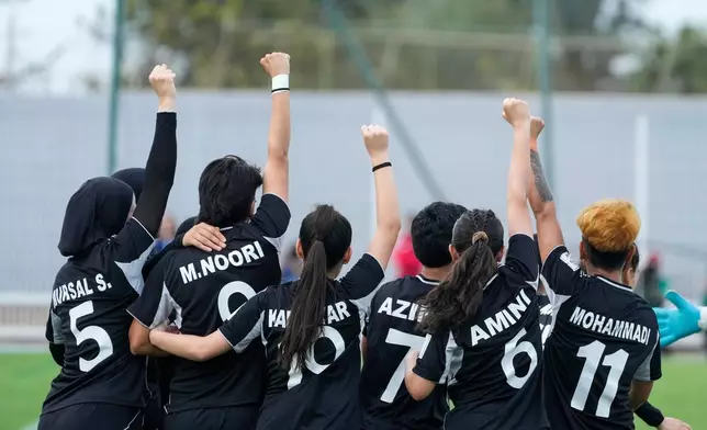 FILE - Members of Afghan Women United soccer team celebrate after scoring a goal against Chad, Sunday, Oct. 26, 2025, in Casablanca, Morocco, in their first international tournament since fleeing their country. (AP Photo/Mosa'ab Elshamy, File)