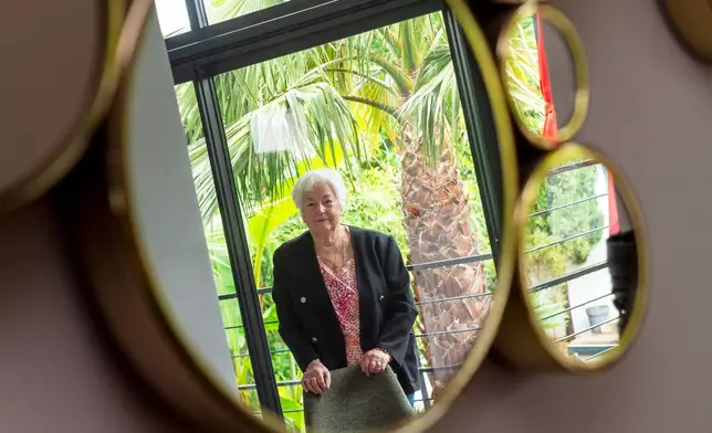 Marie-Therese Ross-Mahe, an 85-year-old French widow of a U.S. military veteran, poses in Orvault, western France, during an interview with The Associated Press, Monday, May 11, 2026. (AP Photo/Mathieu Pattier)