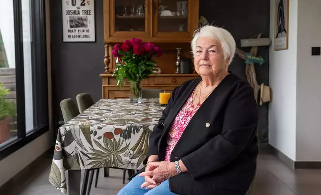 Marie-Therese Ross-Mahe, an 85-year-old French widow of a U.S. military veteran, poses in Orvault, western France, during an interview with The Associated Press, Monday, May 11, 2026. (AP Photo/Mathieu Pattier)