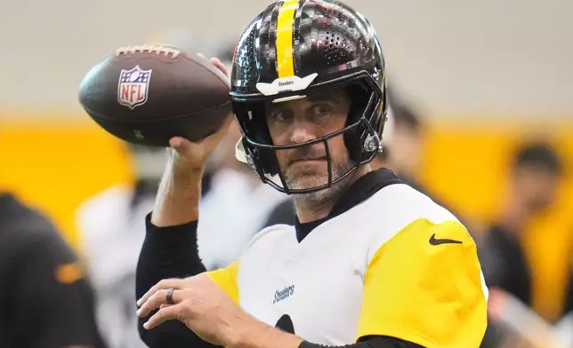 Pittsburgh Steelers quarterback Aaron Rodgers (8) throws during NFL football practice in Pittsburgh, Wednesday, May 20, 2026. (AP Photo/Gene J. Puskar)