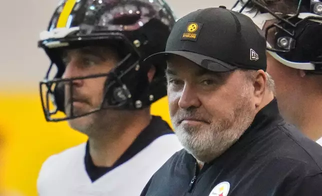 Pittsburgh Steelers quarterback Aaron Rodgers, left, and head coach Mike McCarthy participate during NFL football practice in Pittsburgh, Wednesday, May 20, 2026. (AP Photo/Gene J. Puskar)