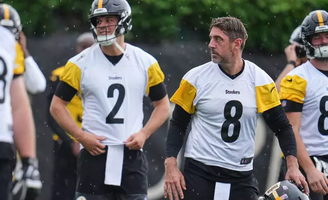 Pittsburgh Steelers quarterbacks Aaron Rodgers (8) and Mason Rudolph (2) participate during NFL football practice in Pittsburgh, Wednesday, May 20, 2026. (AP Photo/Gene J. Puskar)