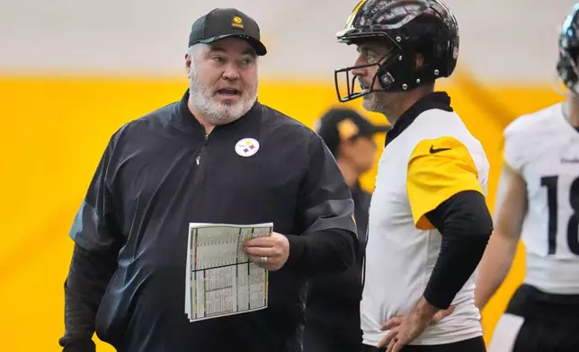 Pittsburgh Steelers quarterback Aaron Rodgers, right, listens to head coach Mike McCarthy during NFL football practice in Pittsburgh, Wednesday, May 20, 2026. (AP Photo/Gene J. Puskar)