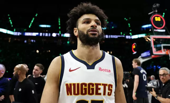 Denver Nuggets guard Jamal Murray (27) walks off the court after the Nuggets lost to the Minnesota Timberwolves in Game 6 of a first-round NBA basketball playoffs series, Thursday, April 30, 2026, in Minneapolis. (AP Photo/Matt Krohn)