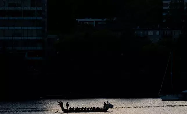 People paddle during practice for the Portland Rose Festival Dragon Boat Race on Monday, May 4, 2026, in Portland, Ore. (AP Photo/Jenny Kane)