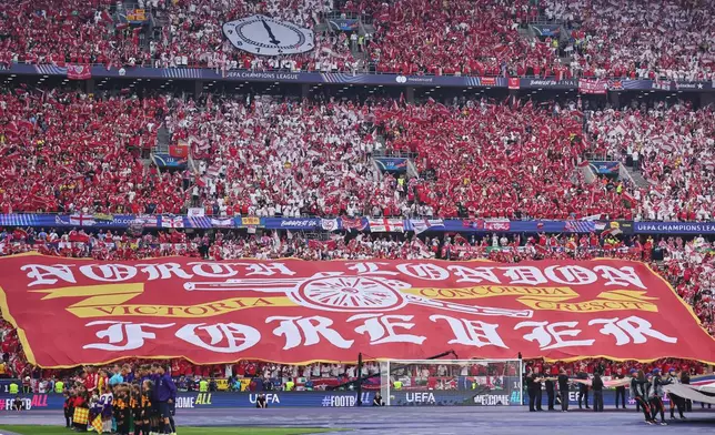 Arsenal fans cheers before the Champions League final soccer match between Paris Saint-Germain and Arsenal in Budapest, Hungary, Saturday, May 30, 2026. AP Photo/Armin Durgut)