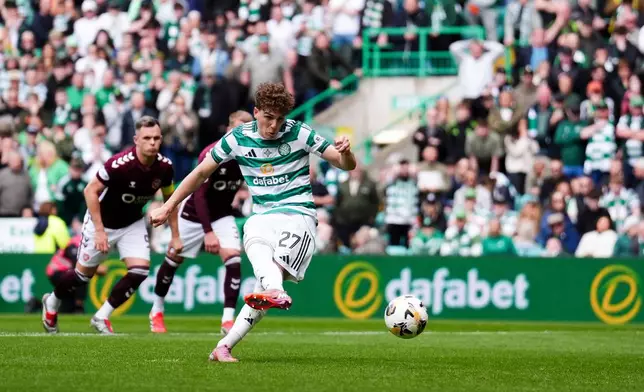 Celtic's Arne Engels scores from the penalty spot during the Premiership soccer match between Celtic and Heart of Midlothian, in Glasgow, Scotland, Saturday May 16, 2026. (Andrew Milligan//PA via AP)