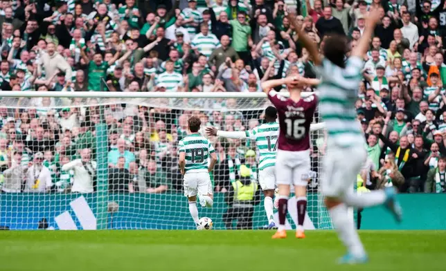 Celtic's Callum Osmand runs clean through to score his side's third goal during the Premiership soccer match between Celtic and Heart of Midlothian, in Glasgow, Scotland, Saturday May 16, 2026. (Andrew Milligan/PA via AP)