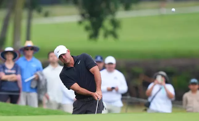 Brooks Koepka hits to the 14th green during the first round of the Byron Nelson golf tournament in McKinney, Texas, Thursday, May 21, 2026. (AP Photo/LM Otero)