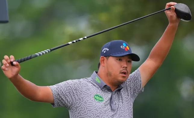 Si Woo Kim, of South Korea, stretches before his tee shot on the 11th hole during the first round of the Byron Nelson golf tournament in McKinney, Texas, Thursday, May 21, 2026. (AP Photo/LM Otero)