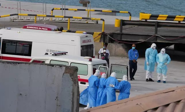 Health workers in protective gear evacuate patients from the MV Hondius cruise ship at a port in Praia, Cape Verde, Wednesday, May 6, 2026. (AP Photo/Misper Apawu)