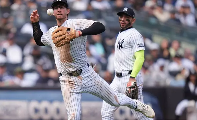 New York Yankees third baseman Ryan McMahon can't make the throw to first during the fourth inning of a baseball game against the Baltimore Orioles, Sunday, May 3, 2026, in New York. (AP Photo/Seth Wenig)